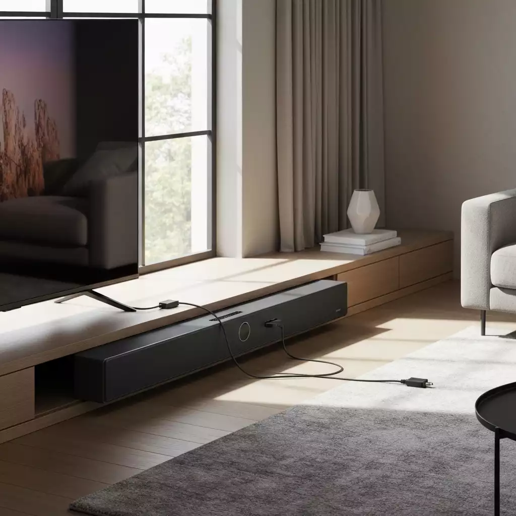 Soundbar and TV connected, cables visible