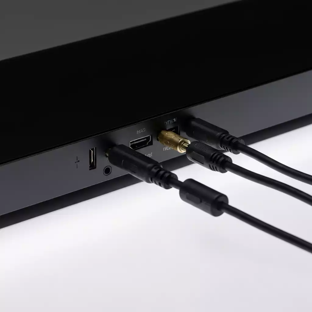 Soundbar with cables connected, illustrating different connection types like HDMI and optical